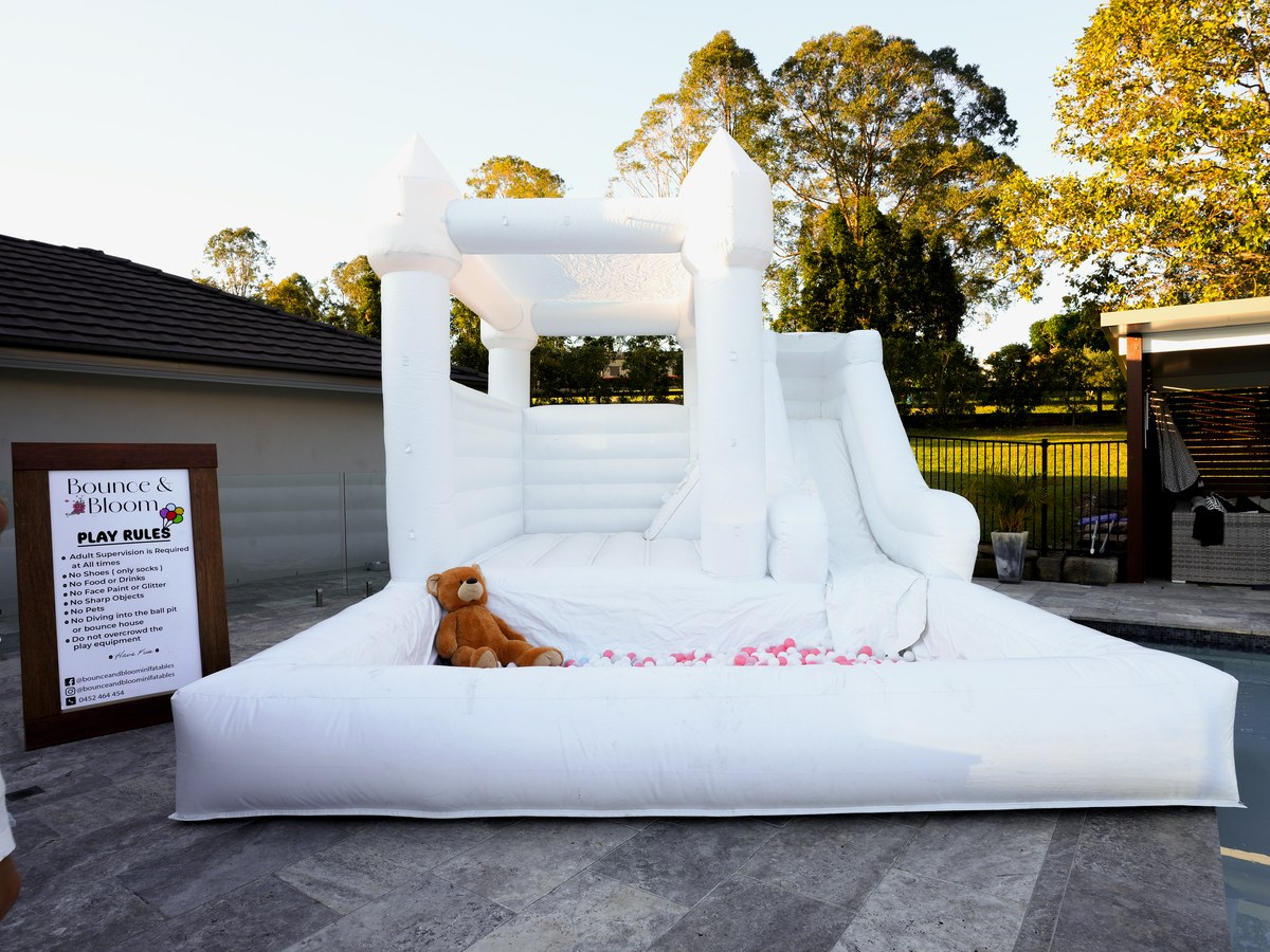 White castle with a ball pit filled with pastel balls