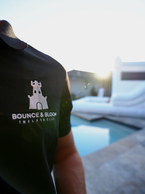 Bounce and Bloom embroidered logo on a branded polo