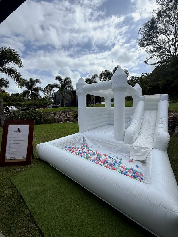 White castle with slide ready for a party
