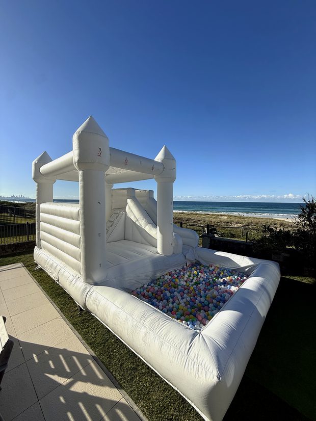 White castle with slide at a party